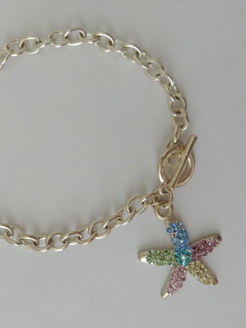 4/$20 Y2K pink blue green tiny crystal starfish pendant silver tone bracelet